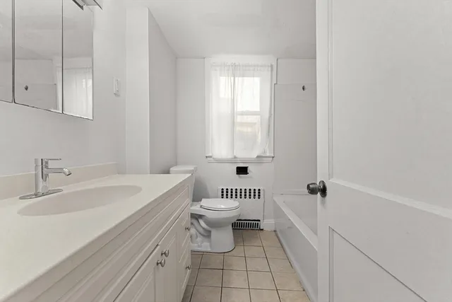 a view of a patio with table and chairs and wooden floor