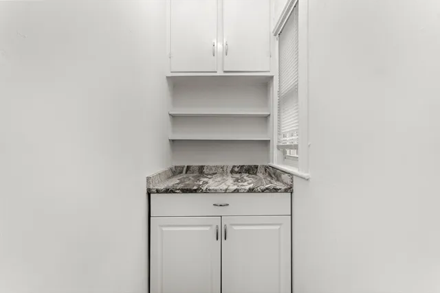 a kitchen with a stove a sink and a refrigerator