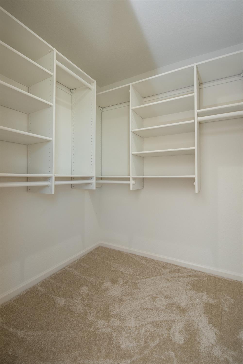 1621 Davis Street Ripon, CA 95366 - Photo 35 of 43 walk in closet with light carpet