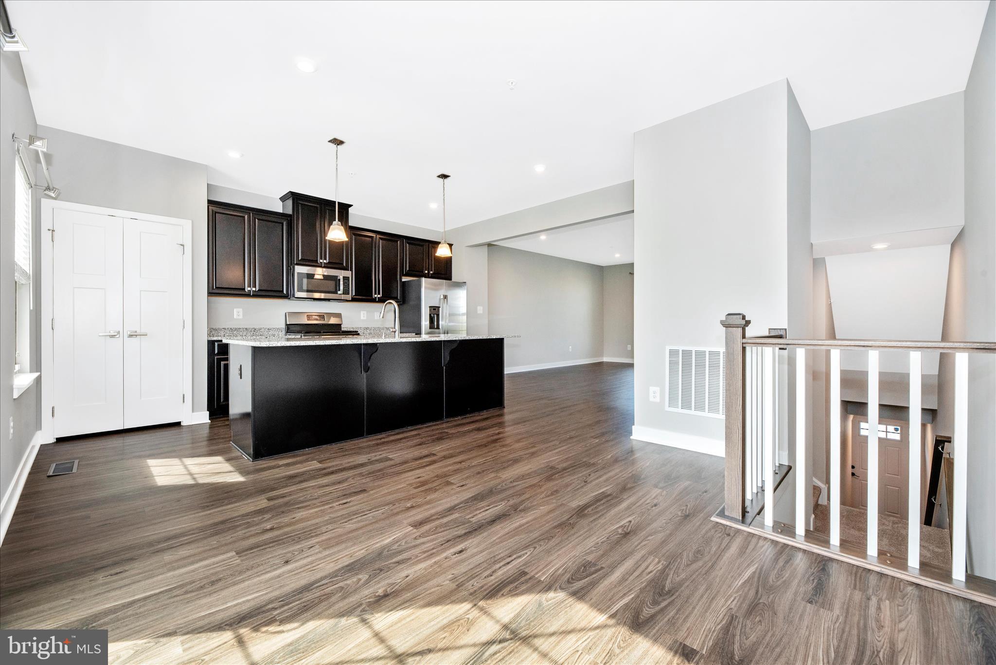 7091 Kokanee Way New Market, MD 21774 - Photo 14 of 69 a view of kitchen with wooden floor and electronic appliances