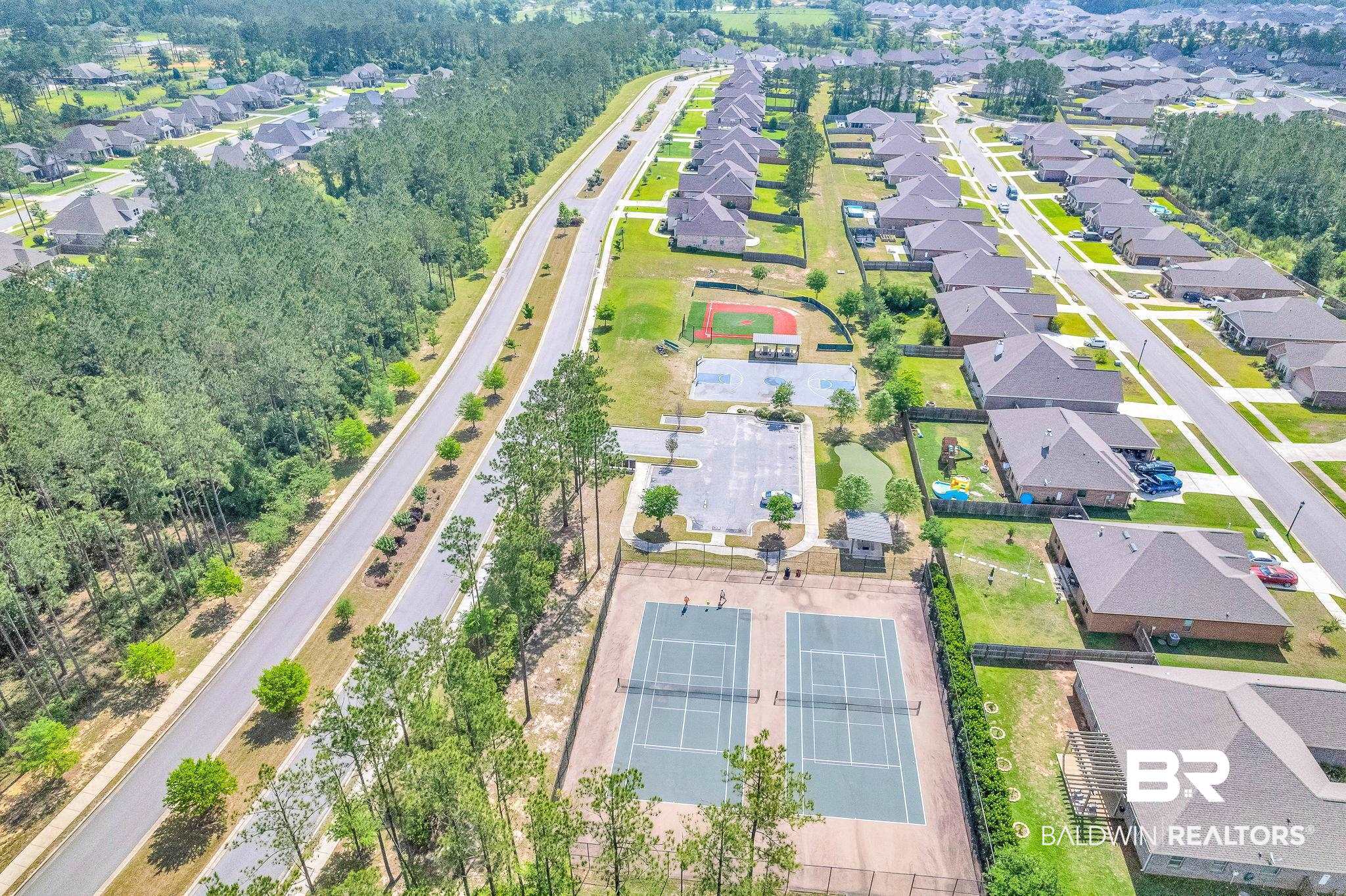 13233 Ibis Boulevard Daphne, AL 36527 - Photo 97 of 100 Aerial perspective of a structured residential community featuring uniform brick homes