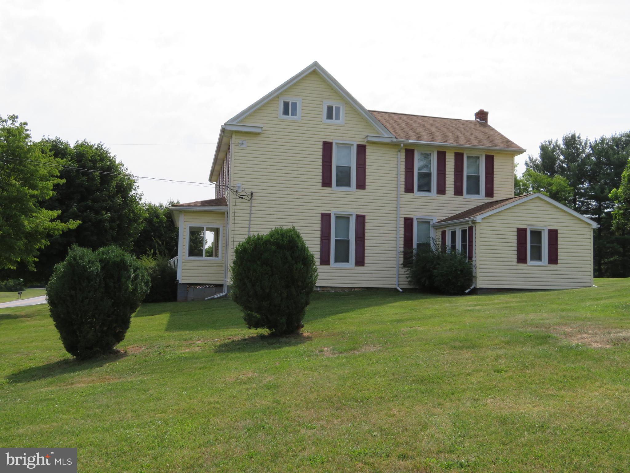 2347 Henshaw Road Inwood, WV 25428 - Photo 50 of 74 a front view of a house with a garden