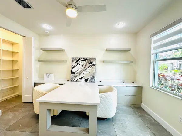 a room with a table and white walls