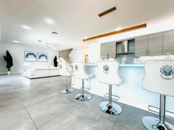 a living room with furniture and a table