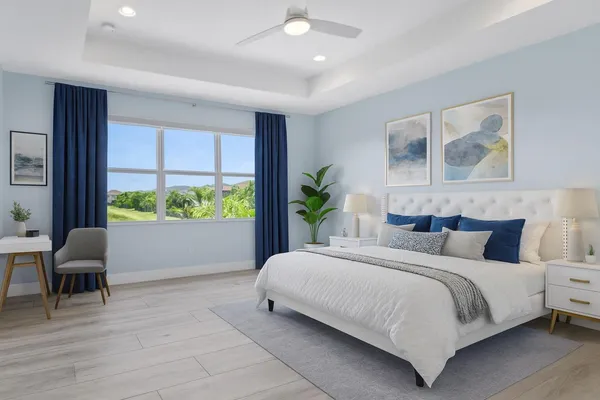 a bedroom with a large bed and a potted plant
