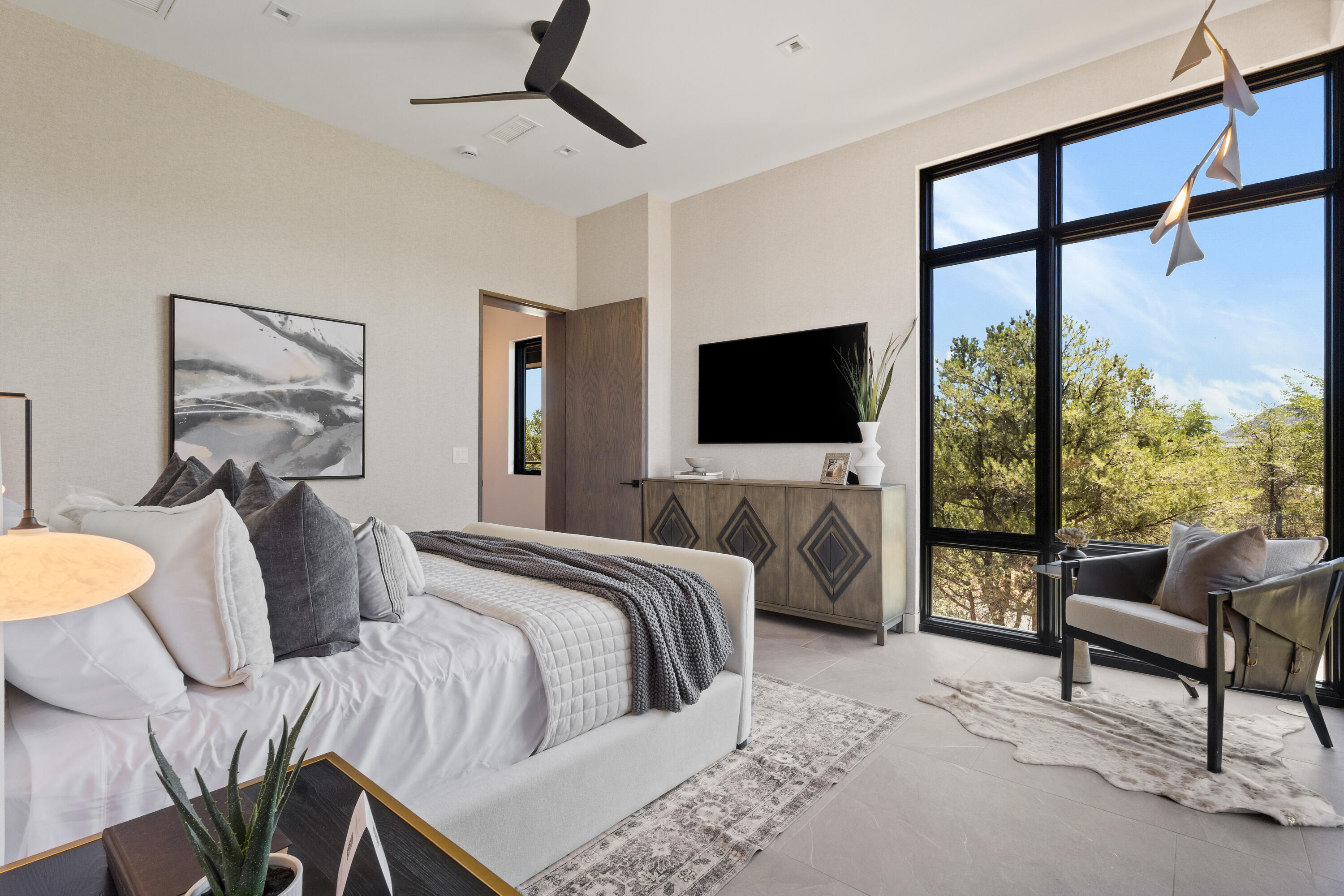 106 South Rim Club Drive Payson, AZ 85541 - Photo 21 of 45 a bedroom with a bed and glass window