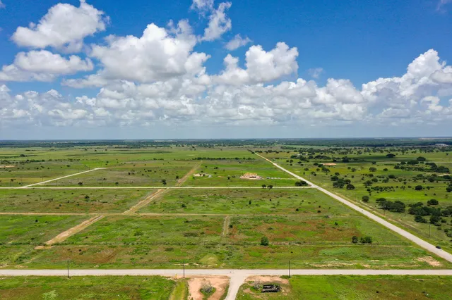 a view of an outdoor space and tennis court