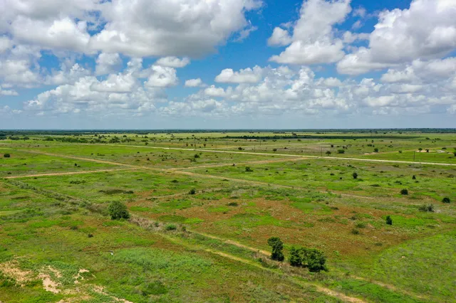 a view of a yard with an ocean
