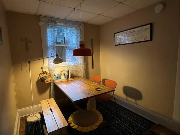 a view of a workspace with furniture and bathroom