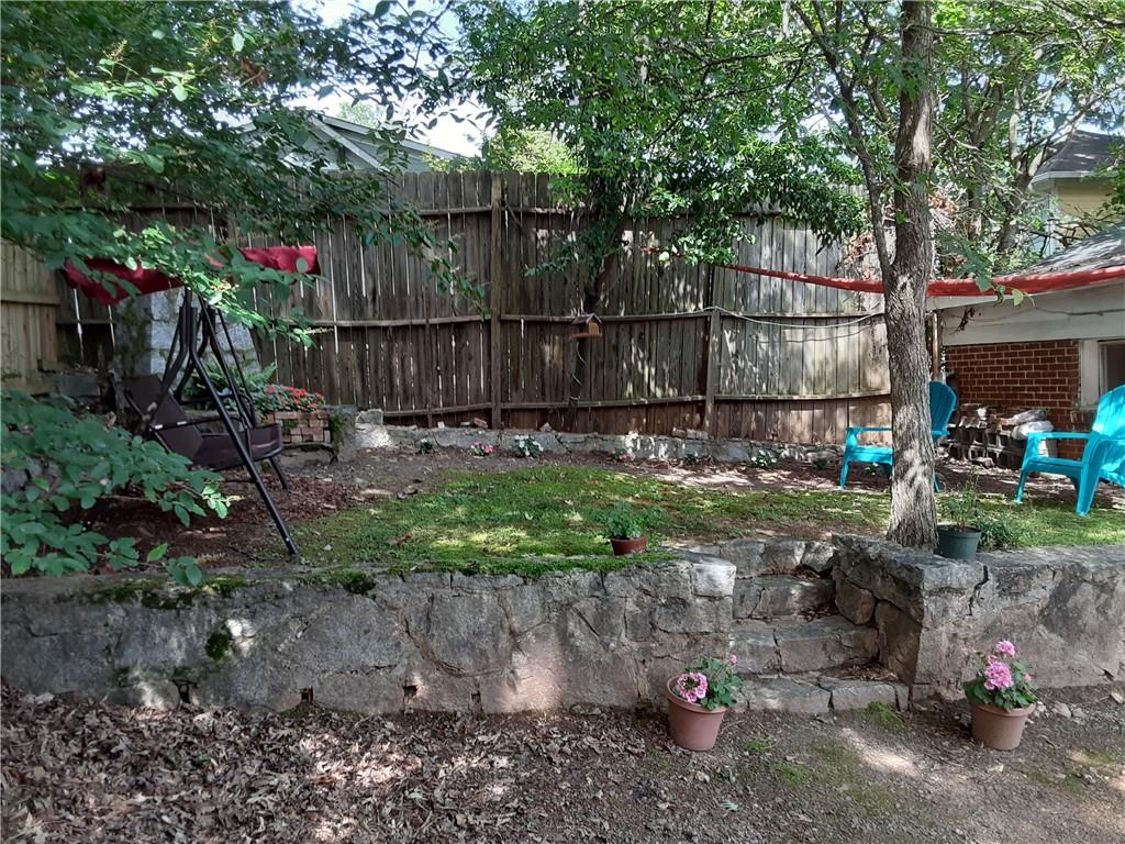 132 Huron Street, Unit 2 Decatur, GA 30030 - Photo 10 of 11 a view of a backyard with wooden fence