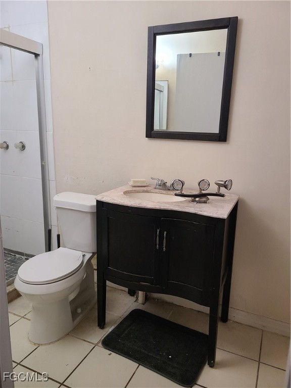 12919 First Street Fort Myers, FL 33905 - Photo 3 of 8 a bathroom with a toilet a sink and mirror
