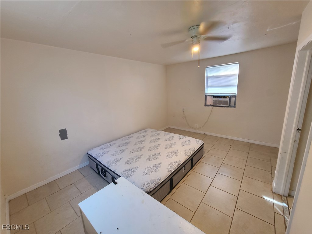 12919 First Street Fort Myers, FL 33905 - Photo 4 of 8 a view of storage and utility room with empty racks