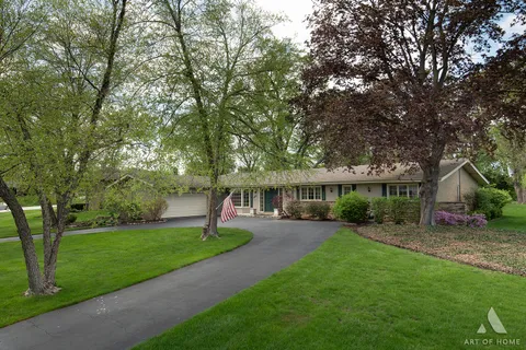 a view of a house with a yard porch and sitting area