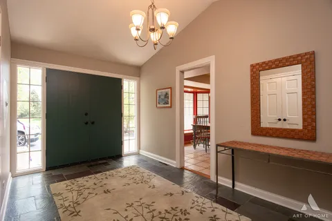 a kitchen with stainless steel appliances granite countertop a sink and a refrigerator
