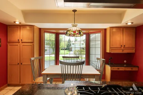 a kitchen with sink a stove and cabinets