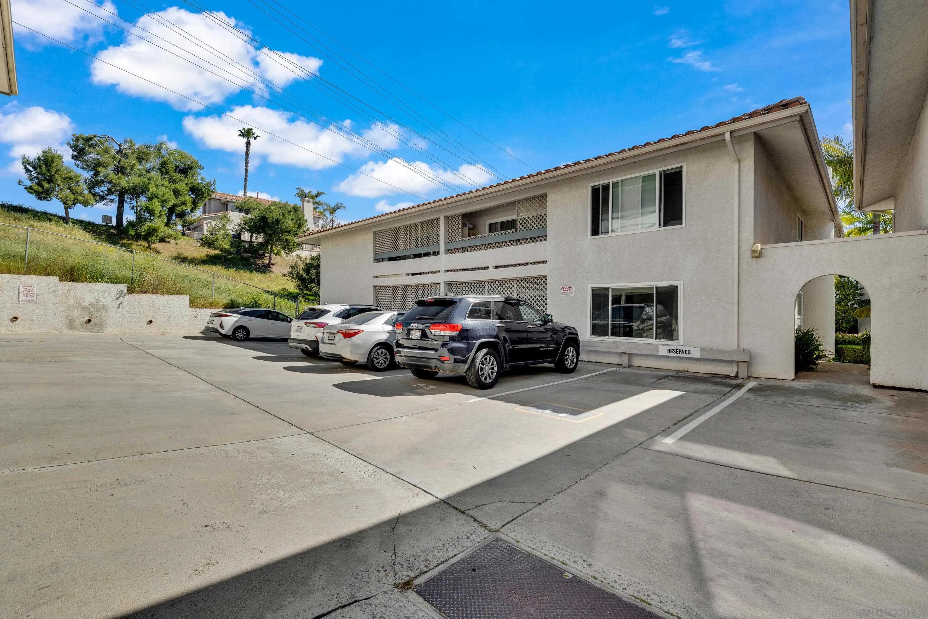 2308 Altisma Way, Unit 118 Carlsbad, CA 92009 - Photo 11 of 51 a view of a car park in front of house