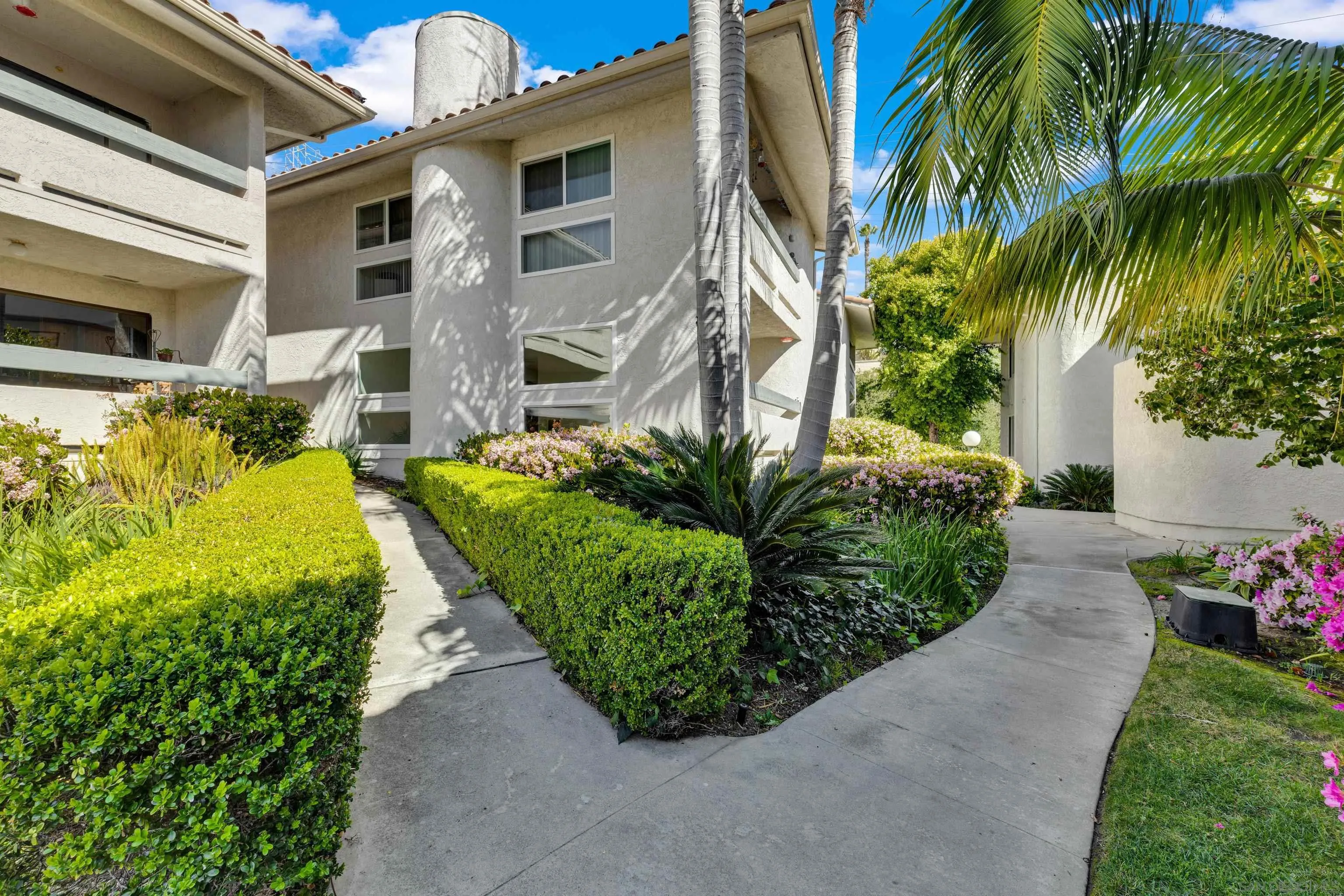 2308 Altisma Way, Unit 118 Carlsbad, CA 92009 - Photo 16 of 51 a view of a house with a backyard