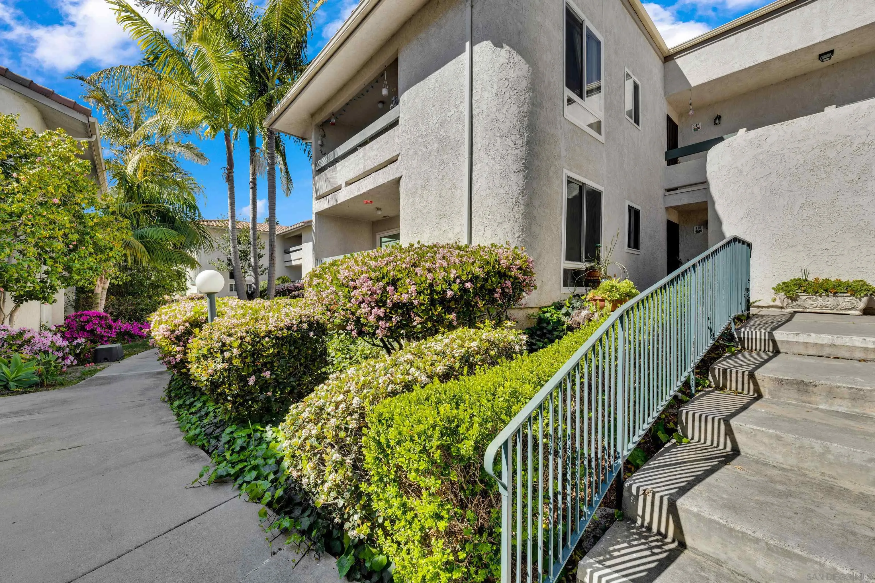 2308 Altisma Way, Unit 118 Carlsbad, CA 92009 - Photo 18 of 51 a view of a house with a flower garden