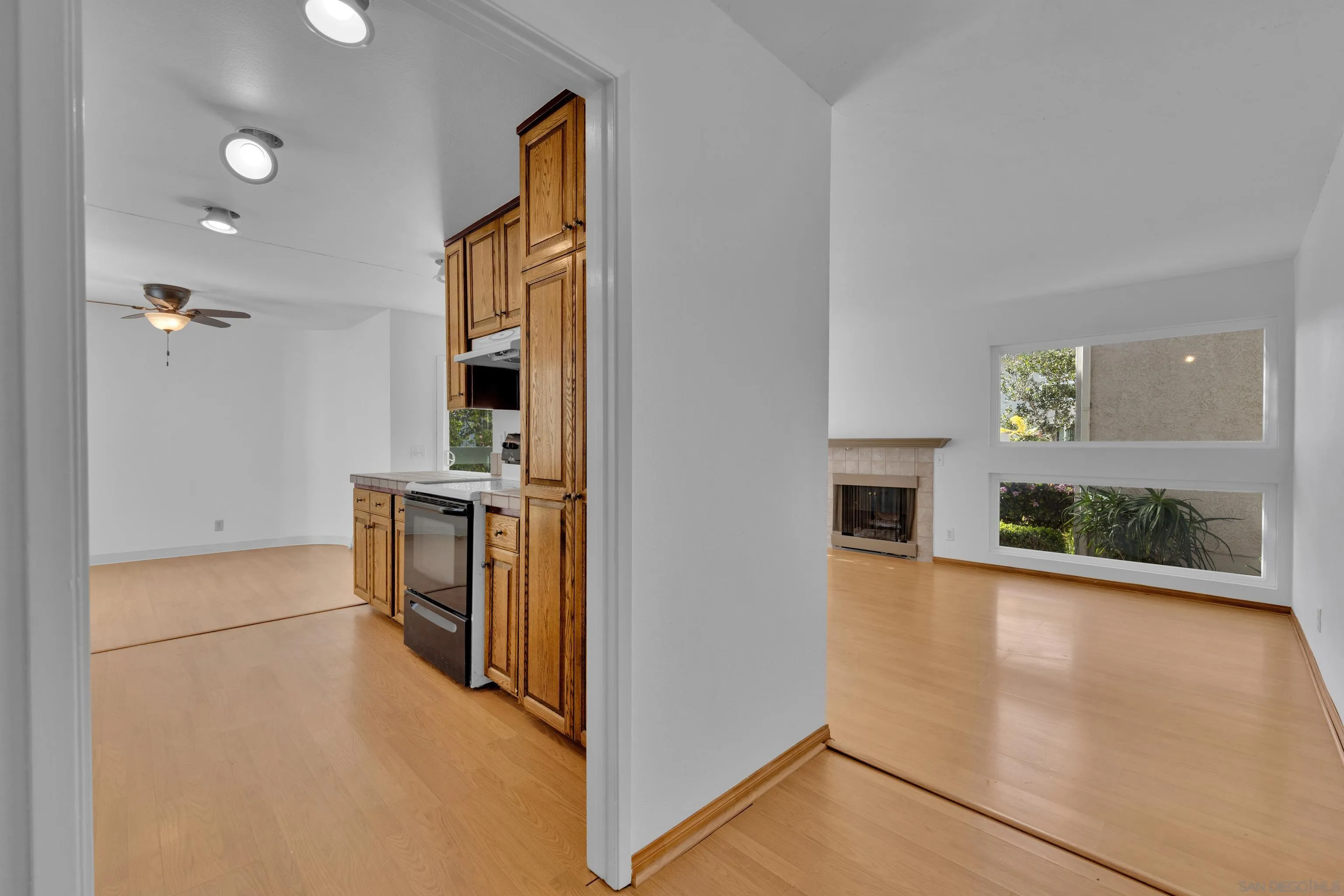 2308 Altisma Way, Unit 118 Carlsbad, CA 92009 - Photo 21 of 51 wooden floor in kitchen and a living room