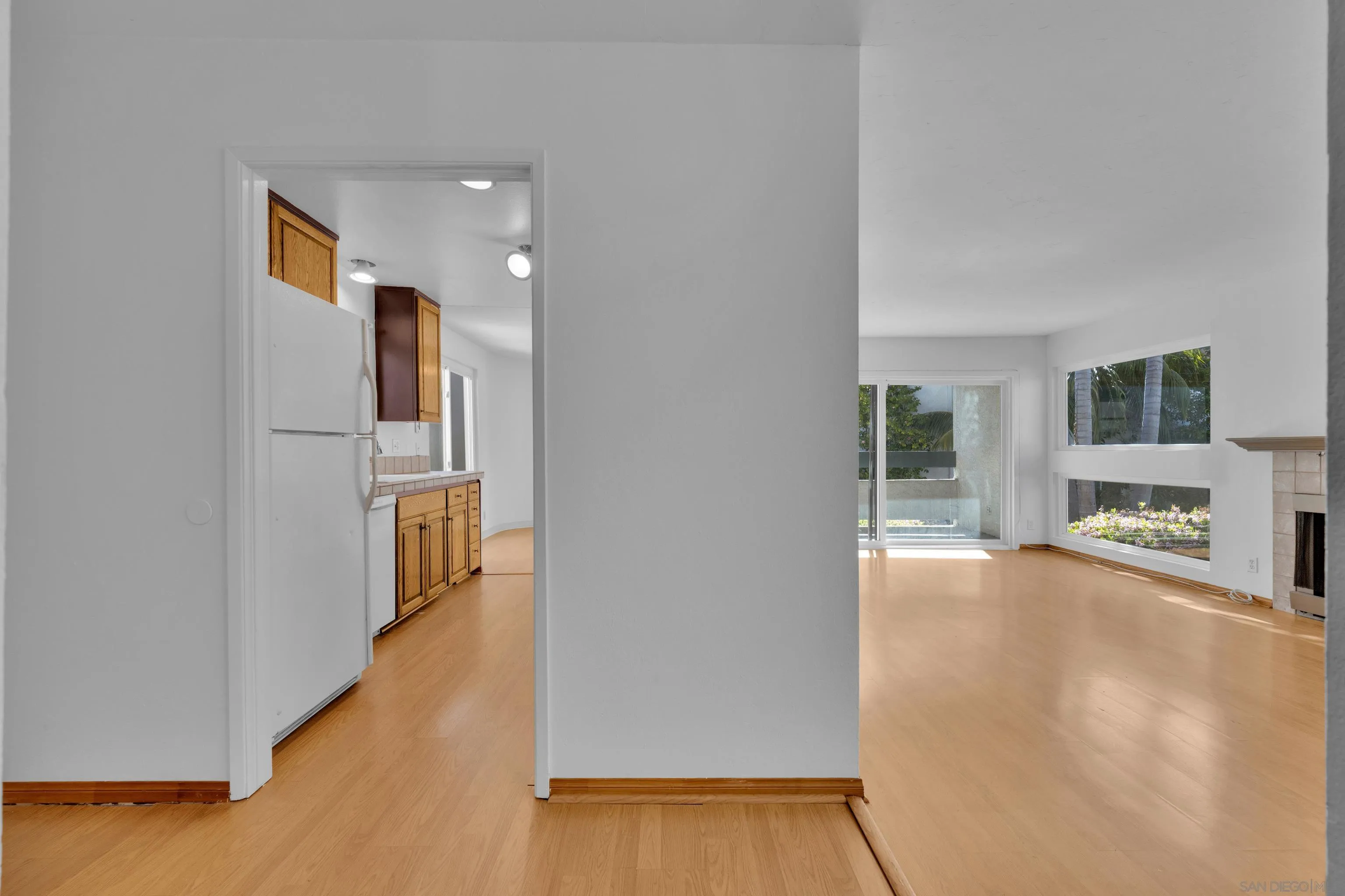 2308 Altisma Way, Unit 118 Carlsbad, CA 92009 - Photo 23 of 51 wooden floor in an empty room with a window