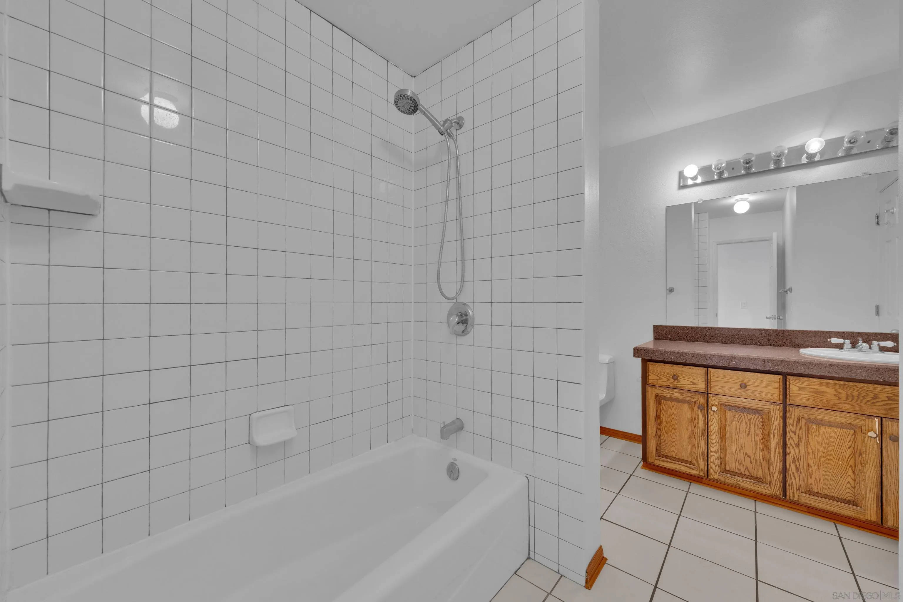 2308 Altisma Way, Unit 118 Carlsbad, CA 92009 - Photo 36 of 51 a bathroom with a bathtub and shower