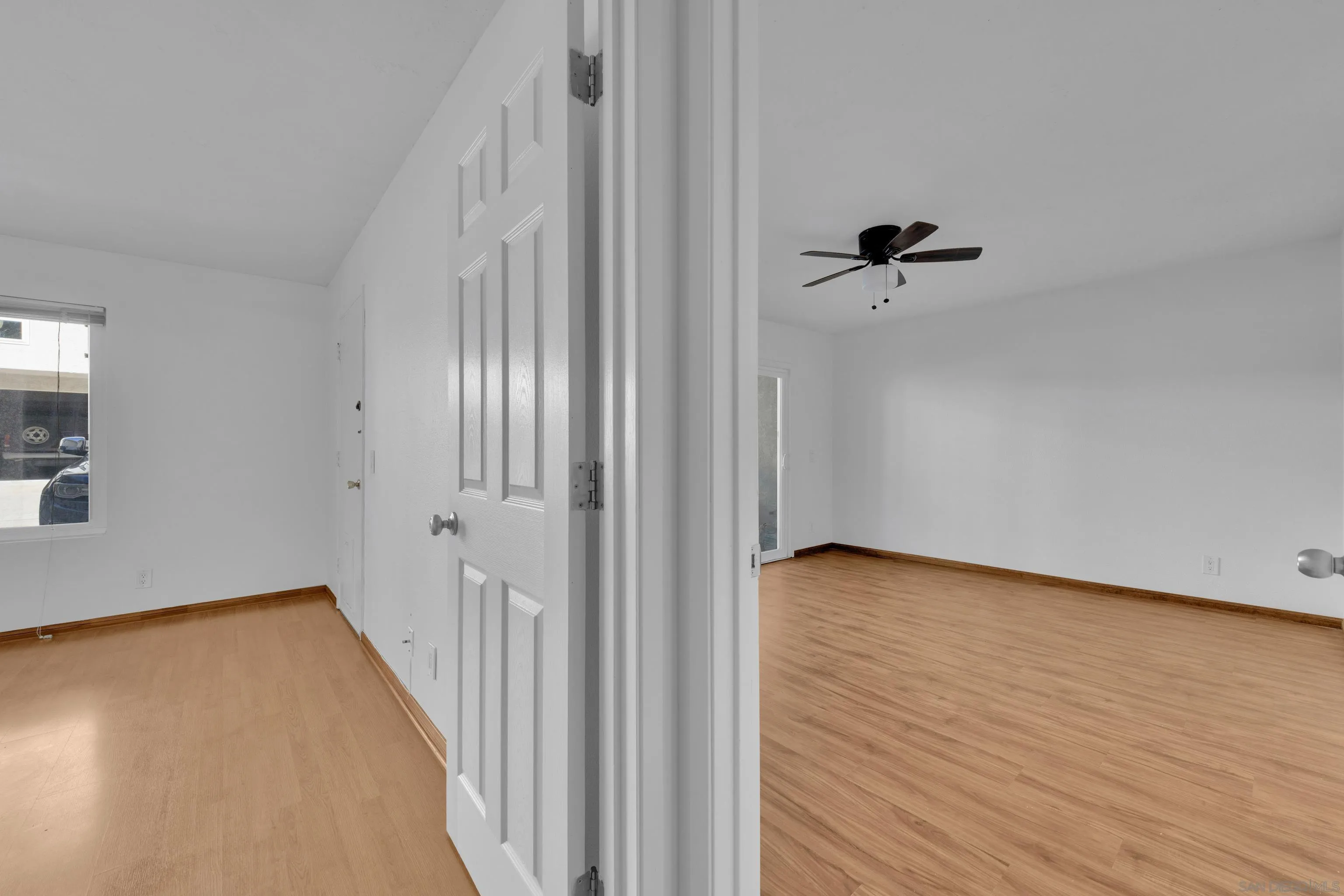2308 Altisma Way, Unit 118 Carlsbad, CA 92009 - Photo 44 of 51 a view of a room with wooden floor