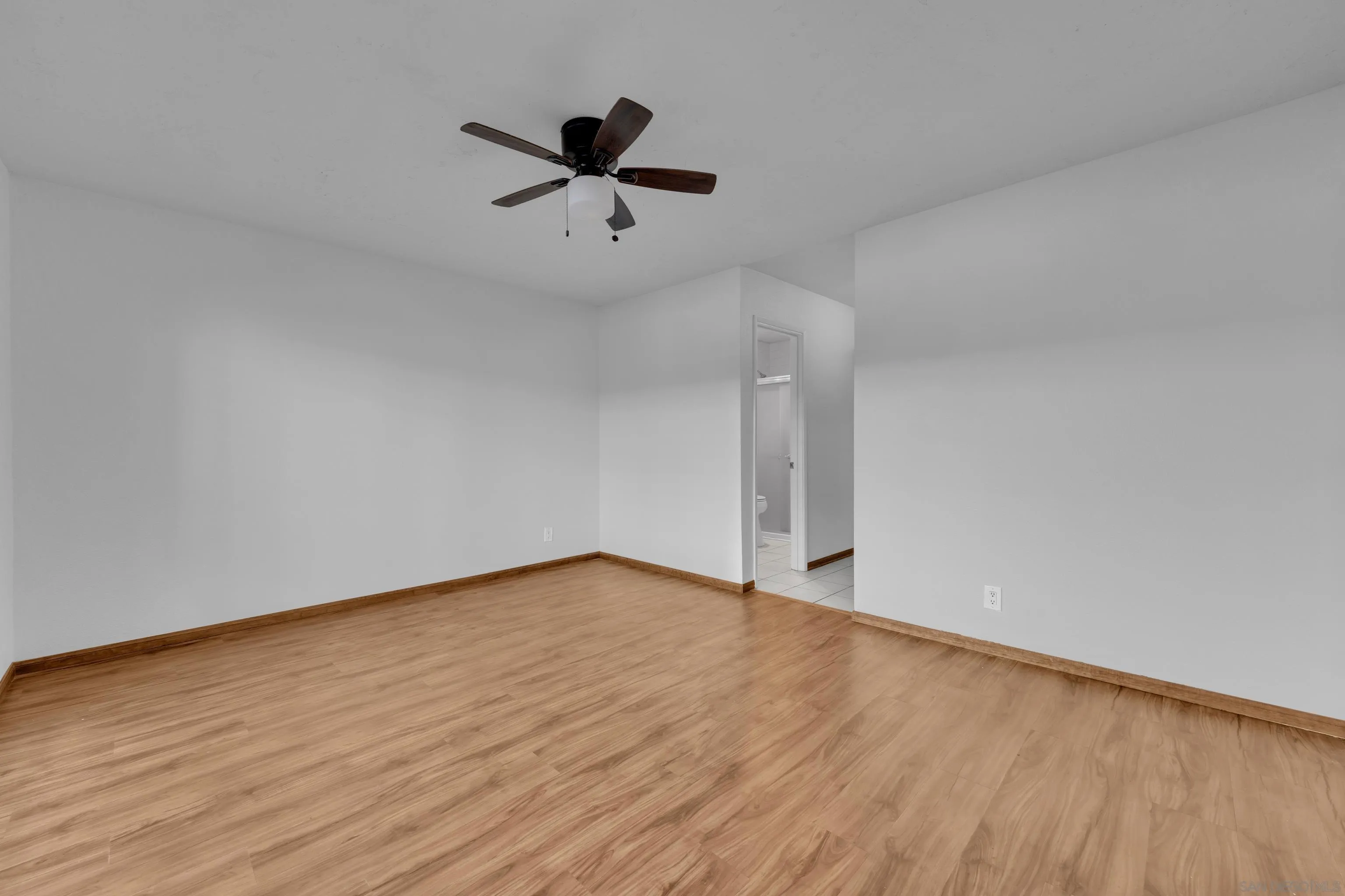 2308 Altisma Way, Unit 118 Carlsbad, CA 92009 - Photo 45 of 51 wooden floor in an empty room