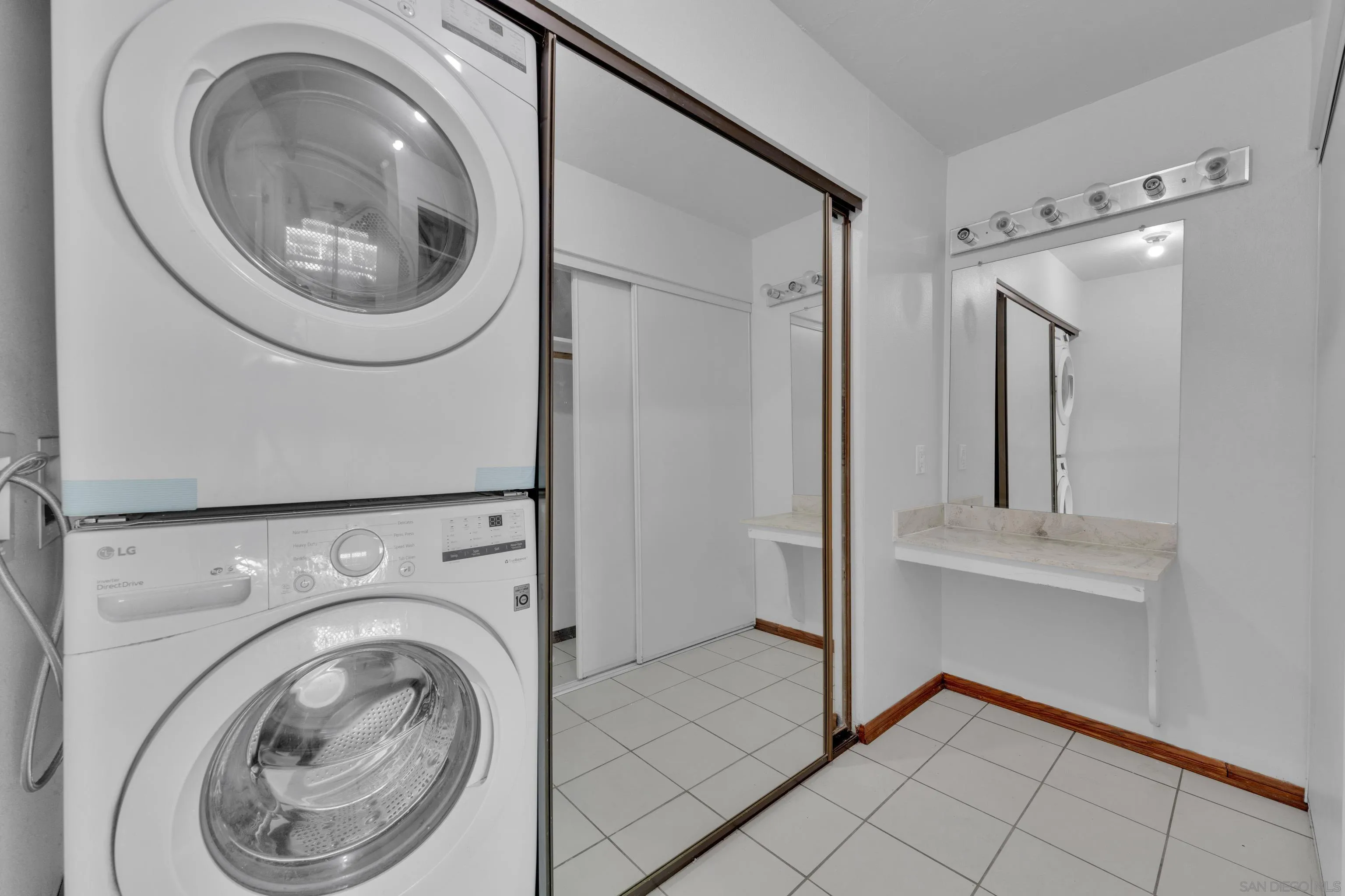 2308 Altisma Way, Unit 118 Carlsbad, CA 92009 - Photo 50 of 51 a view of a hallway with washer and dryer