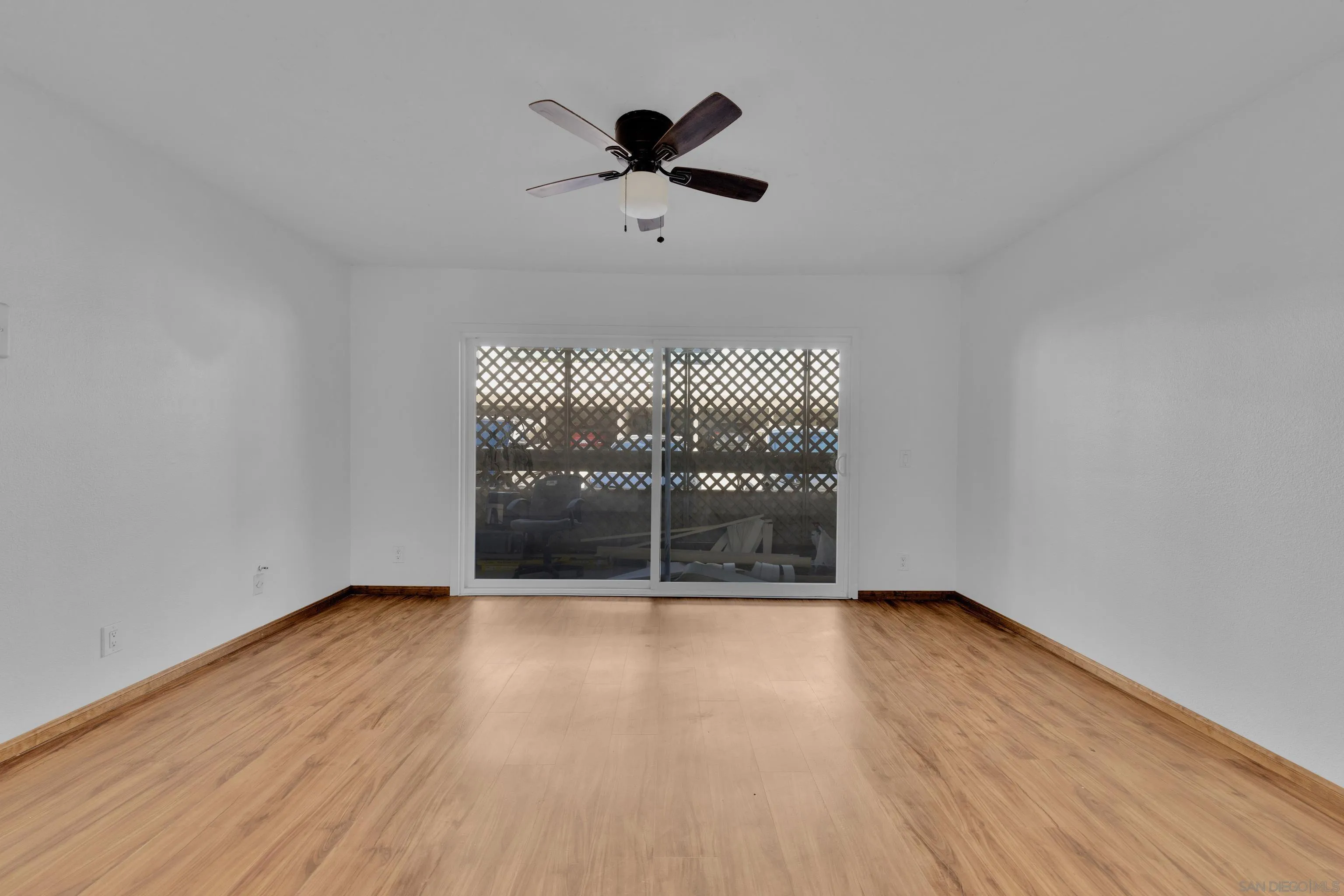 2308 Altisma Way, Unit 118 Carlsbad, CA 92009 - Photo 51 of 51 wooden floor in an empty room with a window
