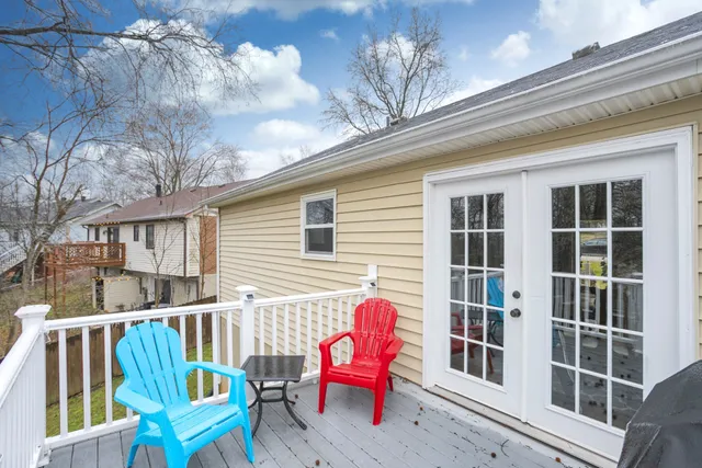 a view of a chair and table in the balcony