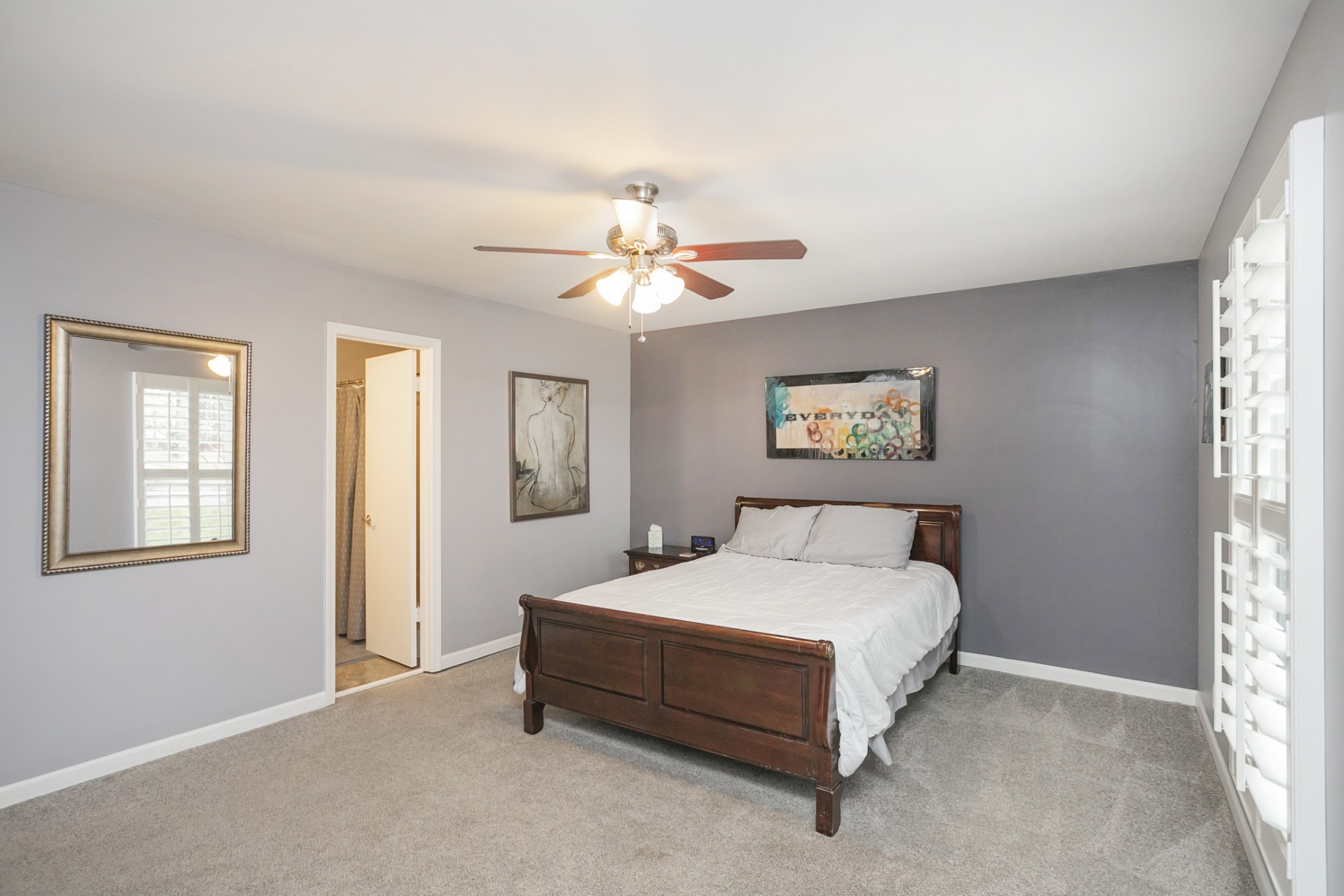 1464 Autumn Knoll Road Hermitage, TN 37076 - Photo 24 of 46 a bedroom with a bed and a chandelier