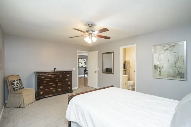 a bedroom with a bed and a dresser