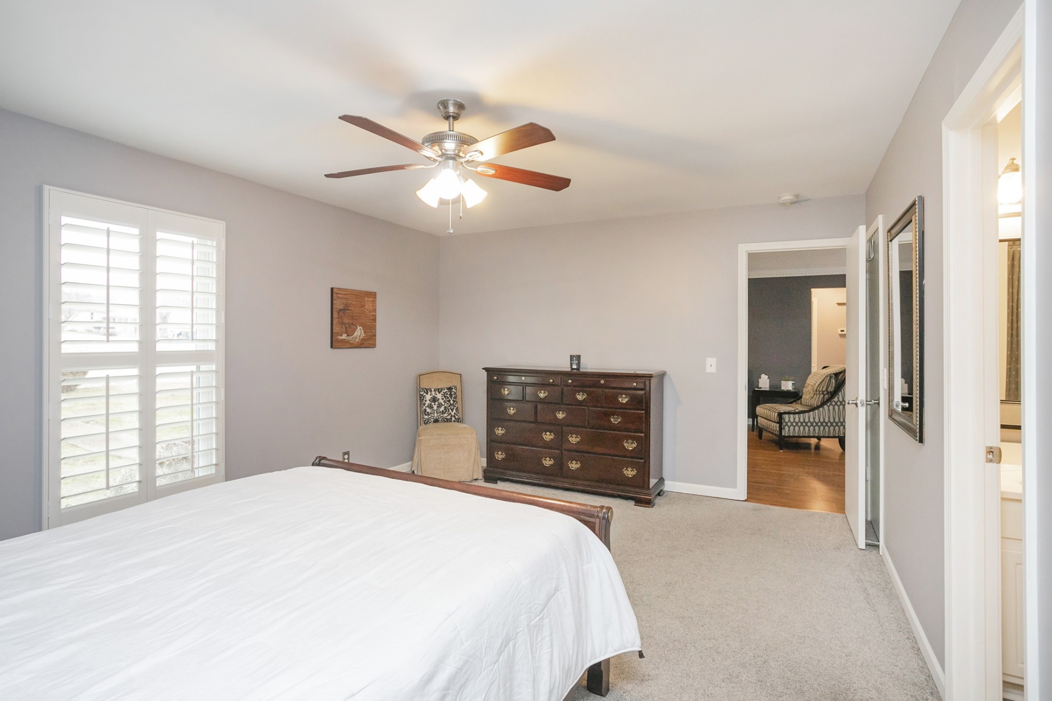 1464 Autumn Knoll Road Hermitage, TN 37076 - Photo 27 of 46 a bedroom with a bed and a chandelier