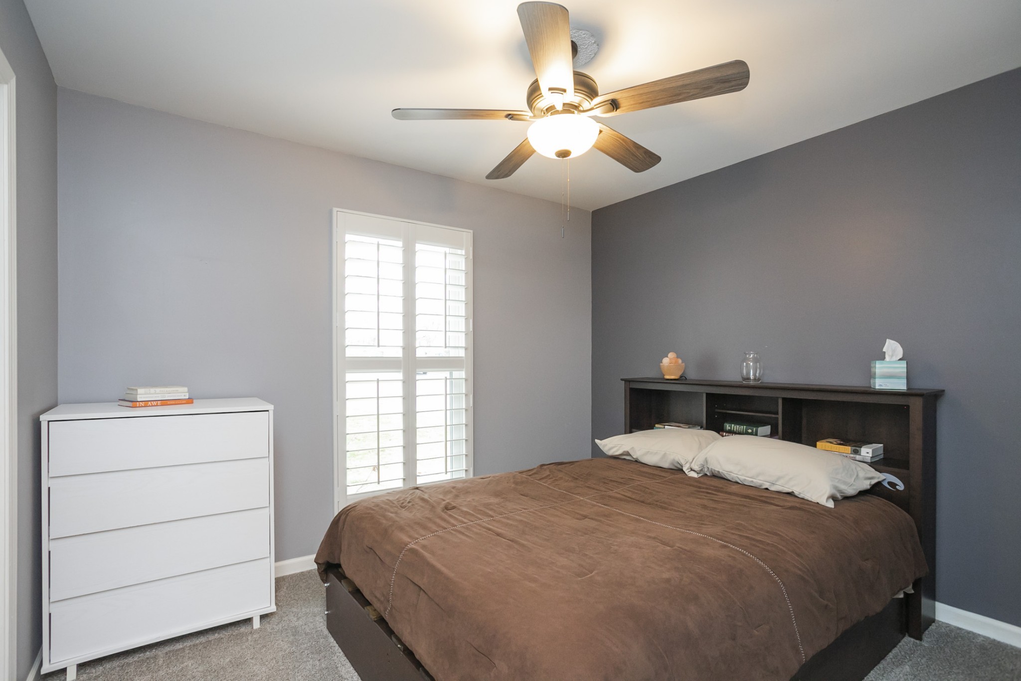 1464 Autumn Knoll Road Hermitage, TN 37076 - Photo 28 of 46 a bedroom with a large bed and a chandelier