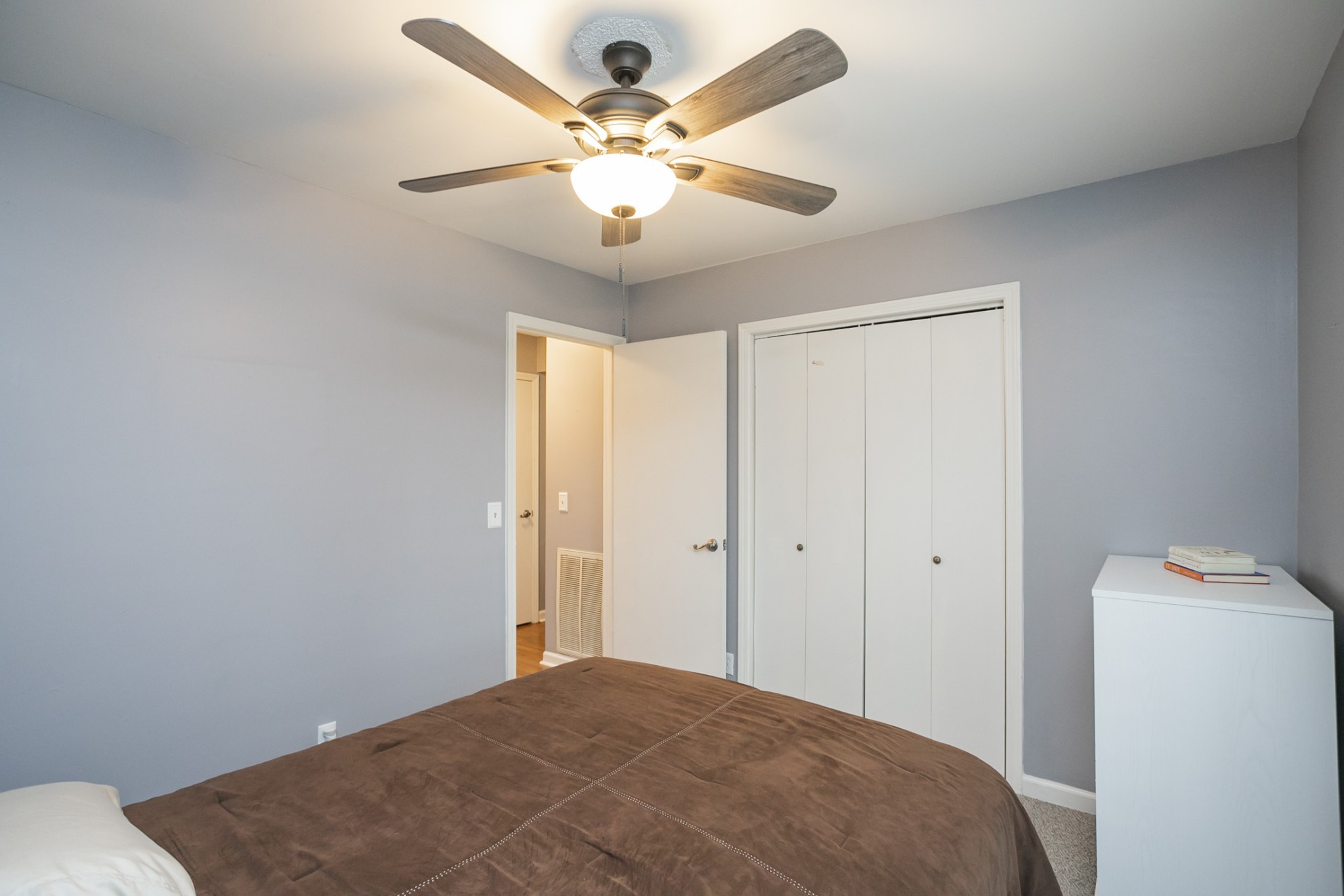 1464 Autumn Knoll Road Hermitage, TN 37076 - Photo 29 of 46 a bedroom with a bed and a chandelier