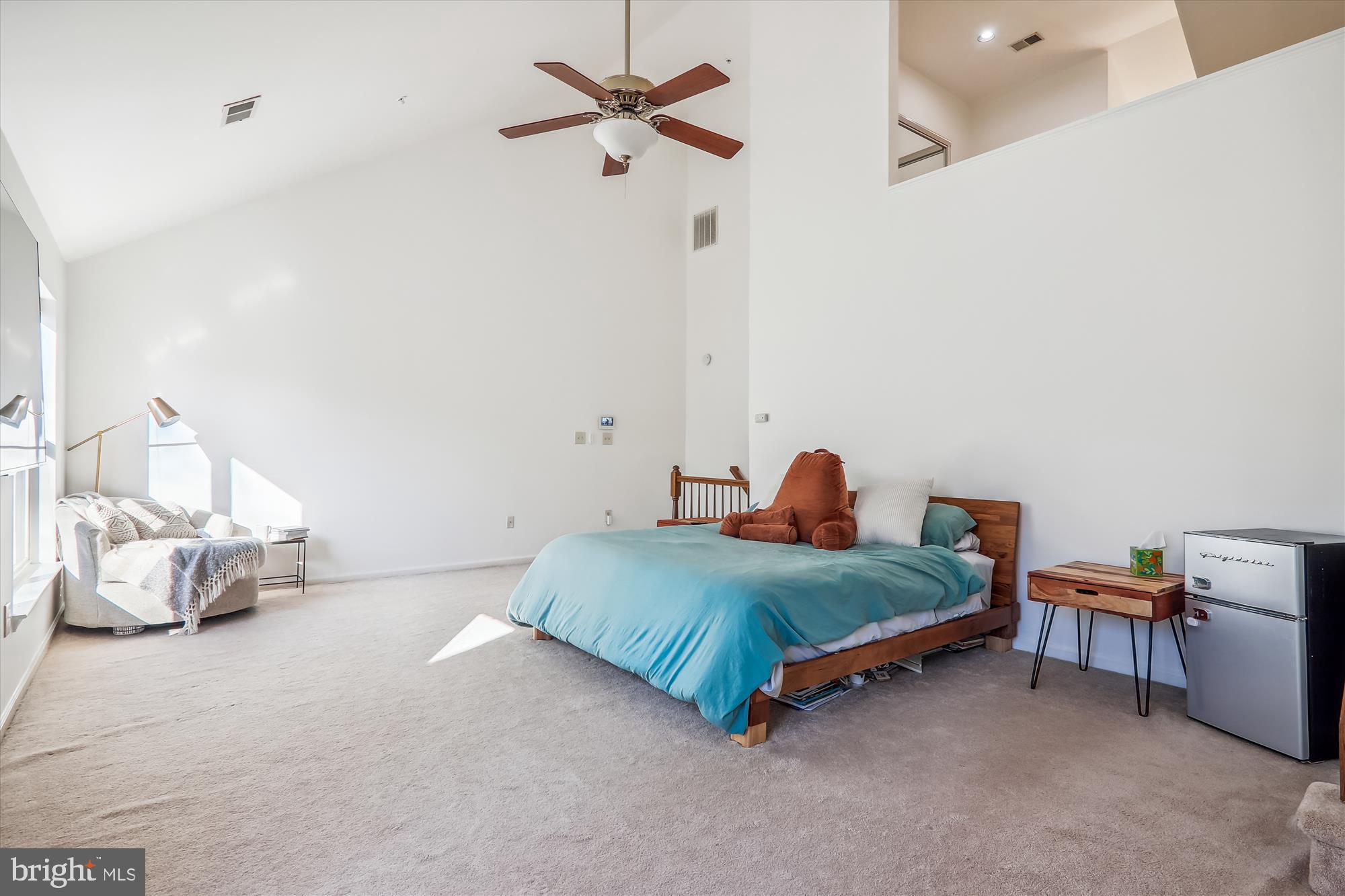 12113 Quilt Patch Lane Bowie, MD 20720 - Photo 12 of 38 a bedroom with a bed and a chandelier