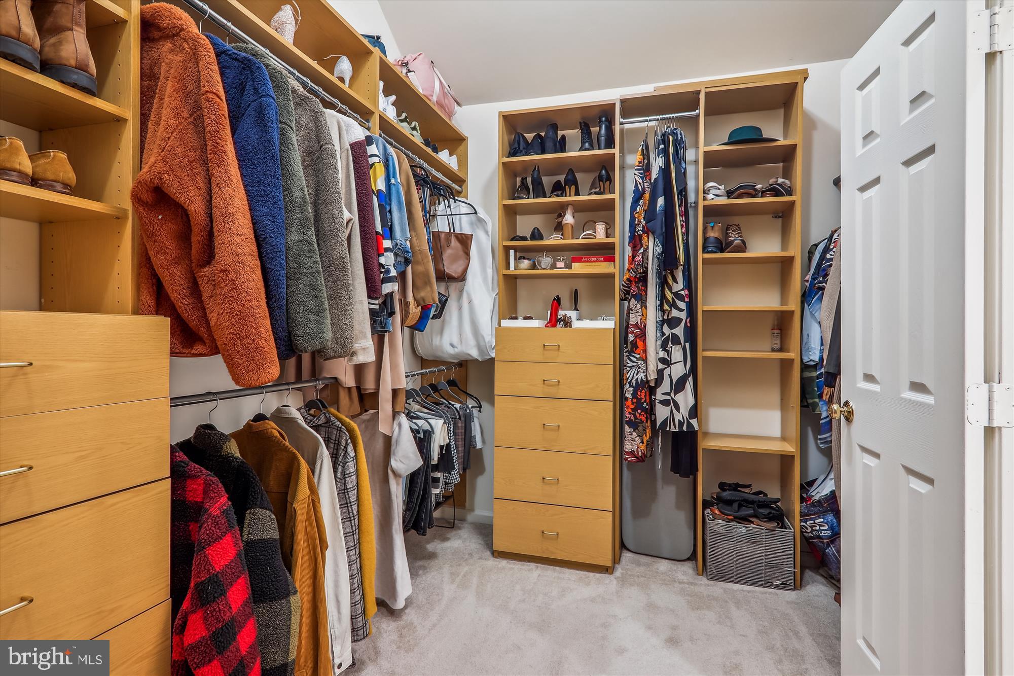 12113 Quilt Patch Lane Bowie, MD 20720 - Photo 14 of 38 a view of walk in closet with clothes and shoes