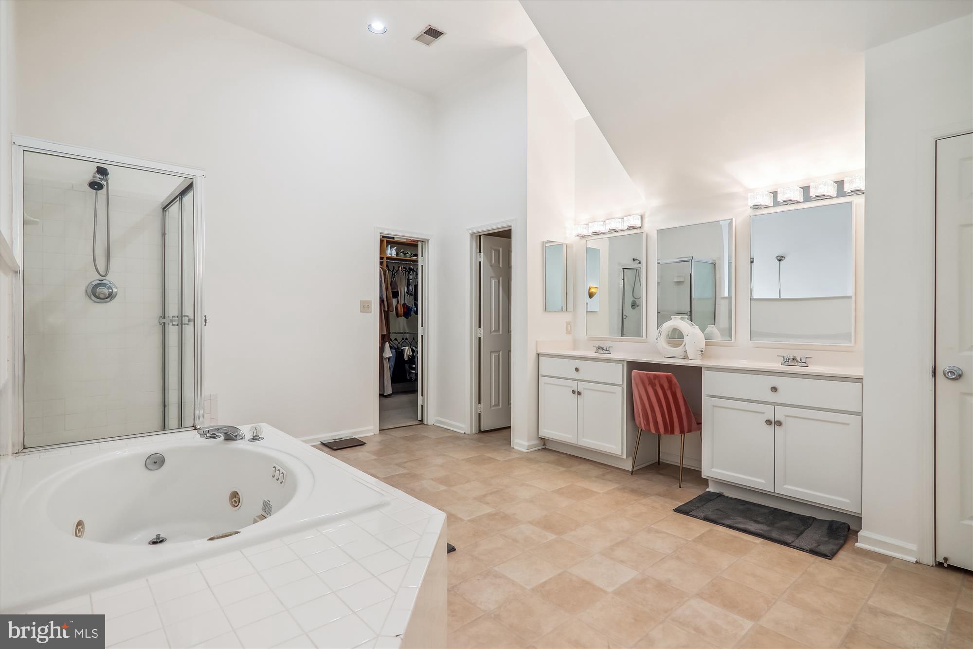 12113 Quilt Patch Lane Bowie, MD 20720 - Photo 15 of 38 a large bathroom with a tub sink shower and mirror
