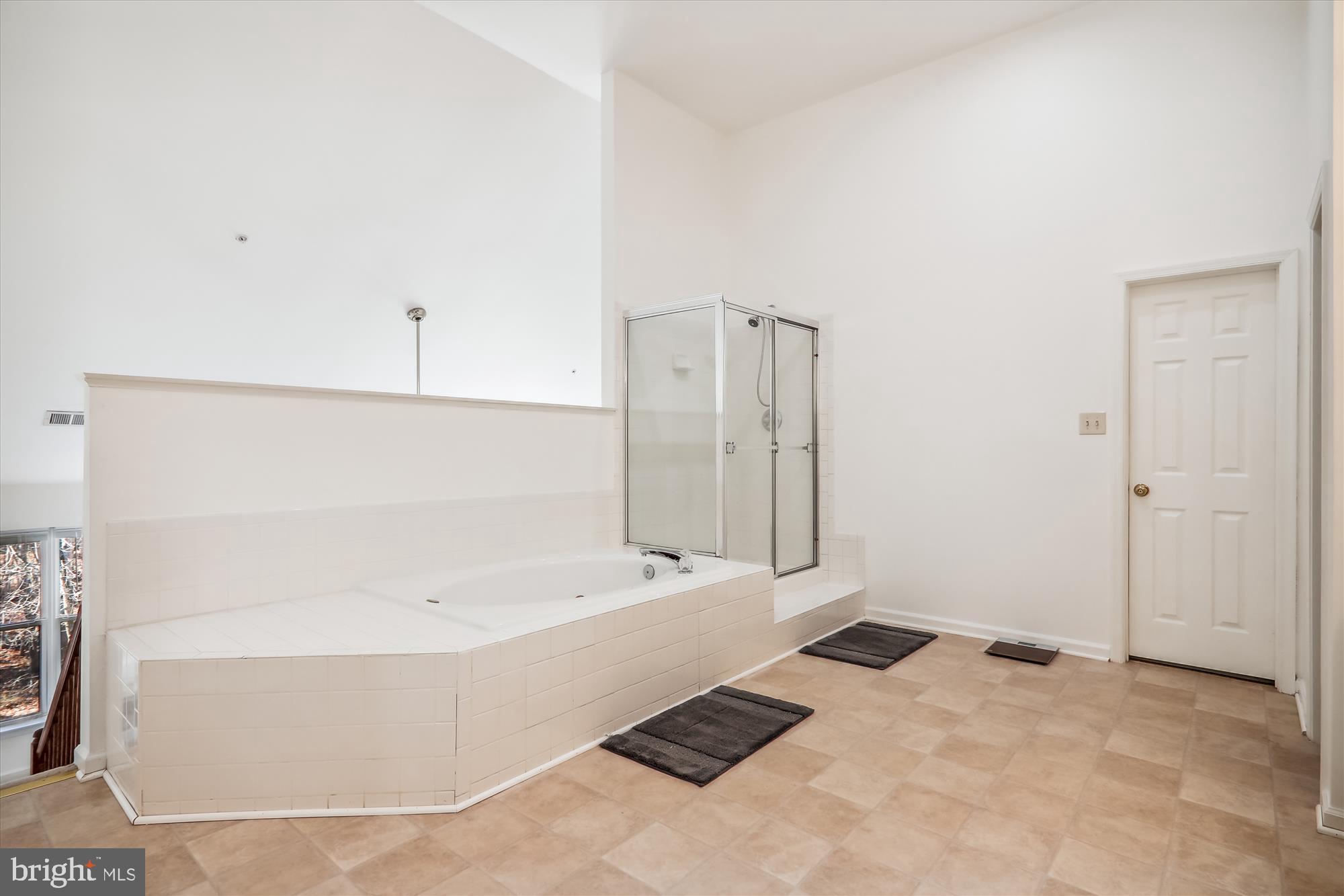 12113 Quilt Patch Lane Bowie, MD 20720 - Photo 16 of 38 a bathroom with a bathtub and shower