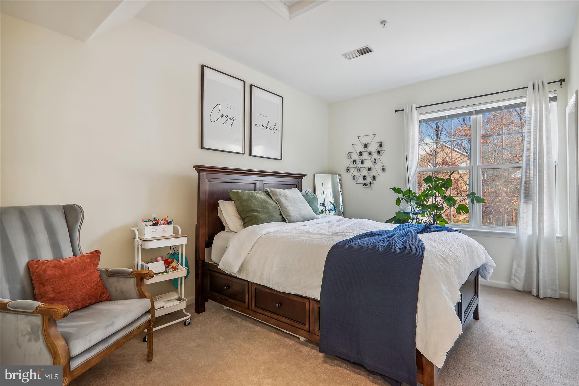 12113 Quilt Patch Lane Bowie, MD 20720 - Photo 17 of 38 a bedroom with a bed and glass window