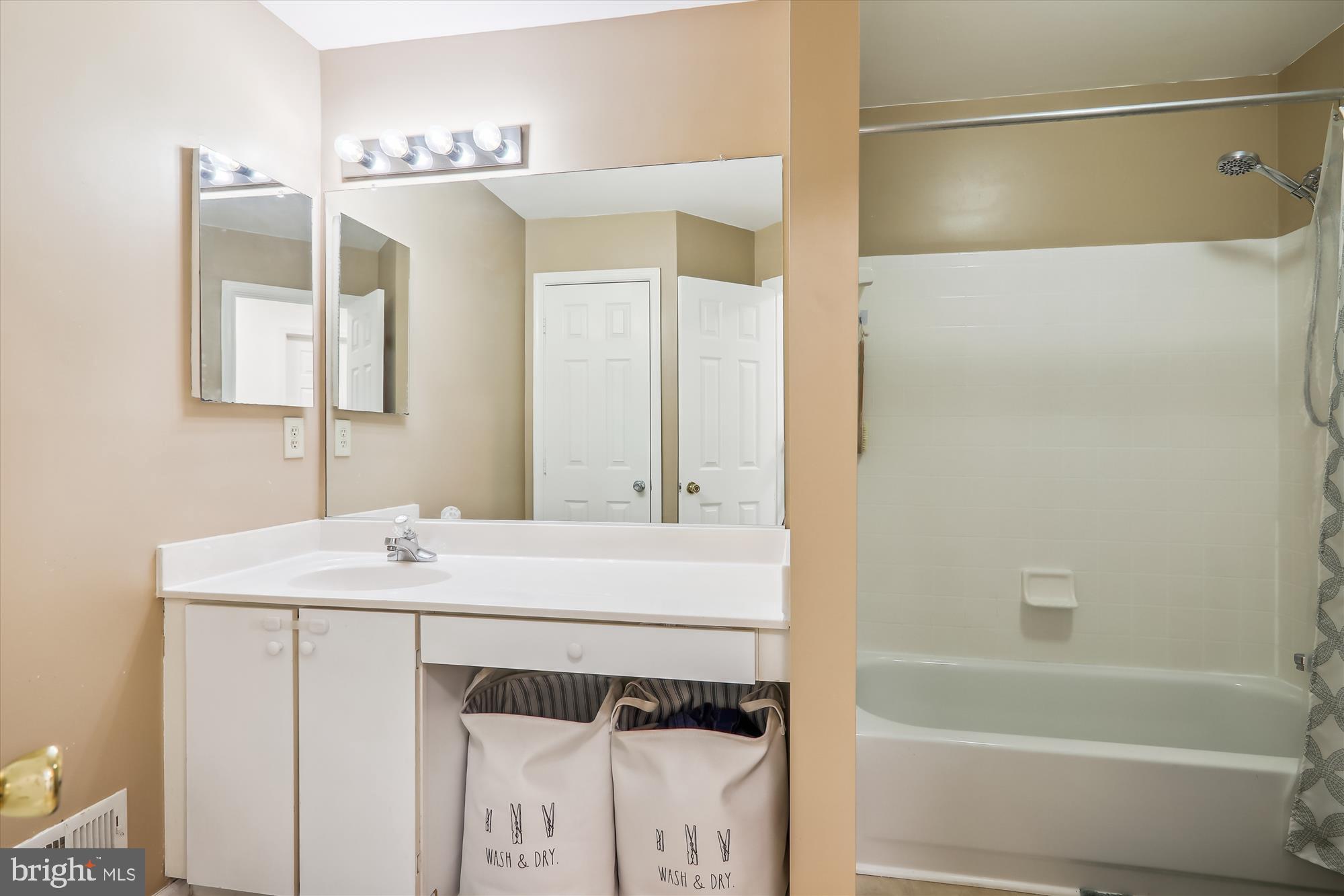 12113 Quilt Patch Lane Bowie, MD 20720 - Photo 18 of 38 a bathroom with a sink and a mirror