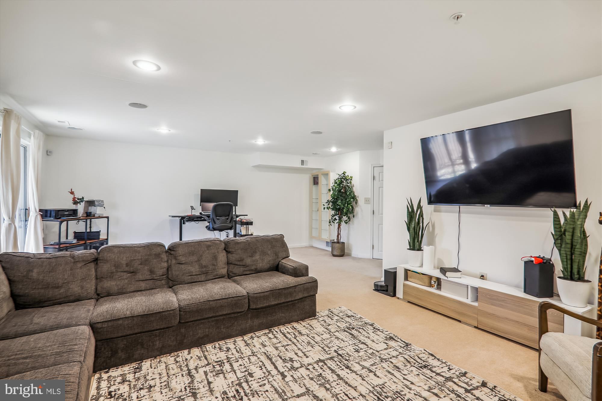 12113 Quilt Patch Lane Bowie, MD 20720 - Photo 22 of 38 a living room with furniture and a flat screen tv