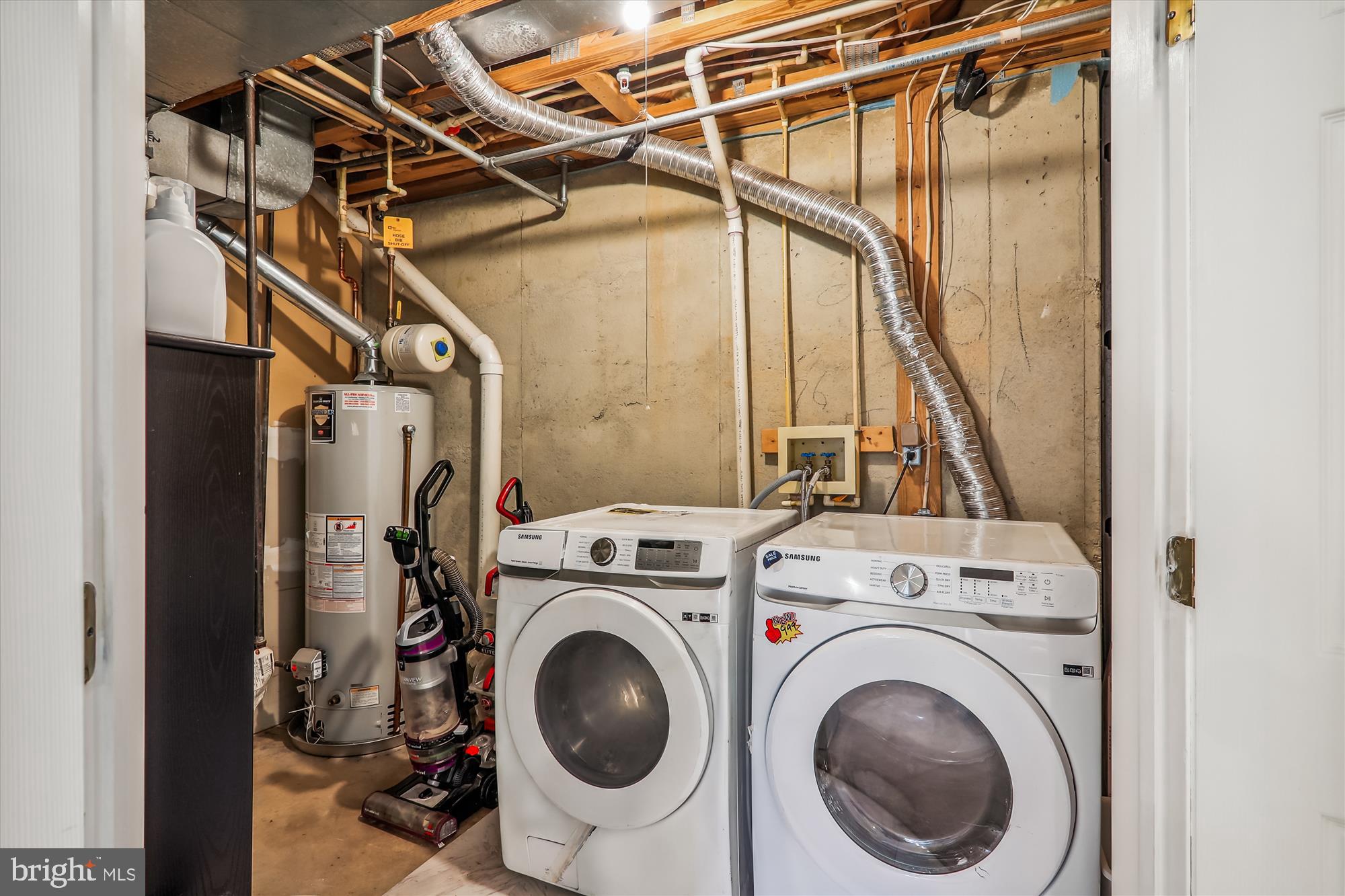 12113 Quilt Patch Lane Bowie, MD 20720 - Photo 26 of 38 a view of storage and utility room with washer and dryer