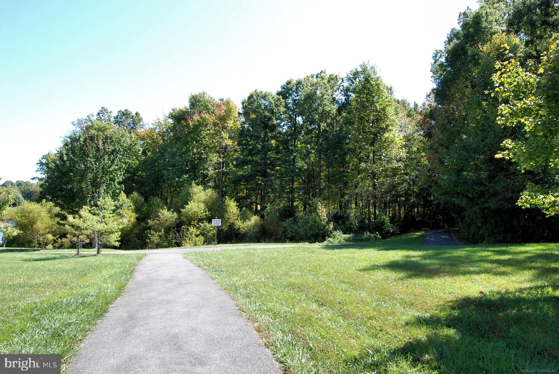 12113 Quilt Patch Lane Bowie, MD 20720 - Photo 30 of 38 a view of a grassy field with trees
