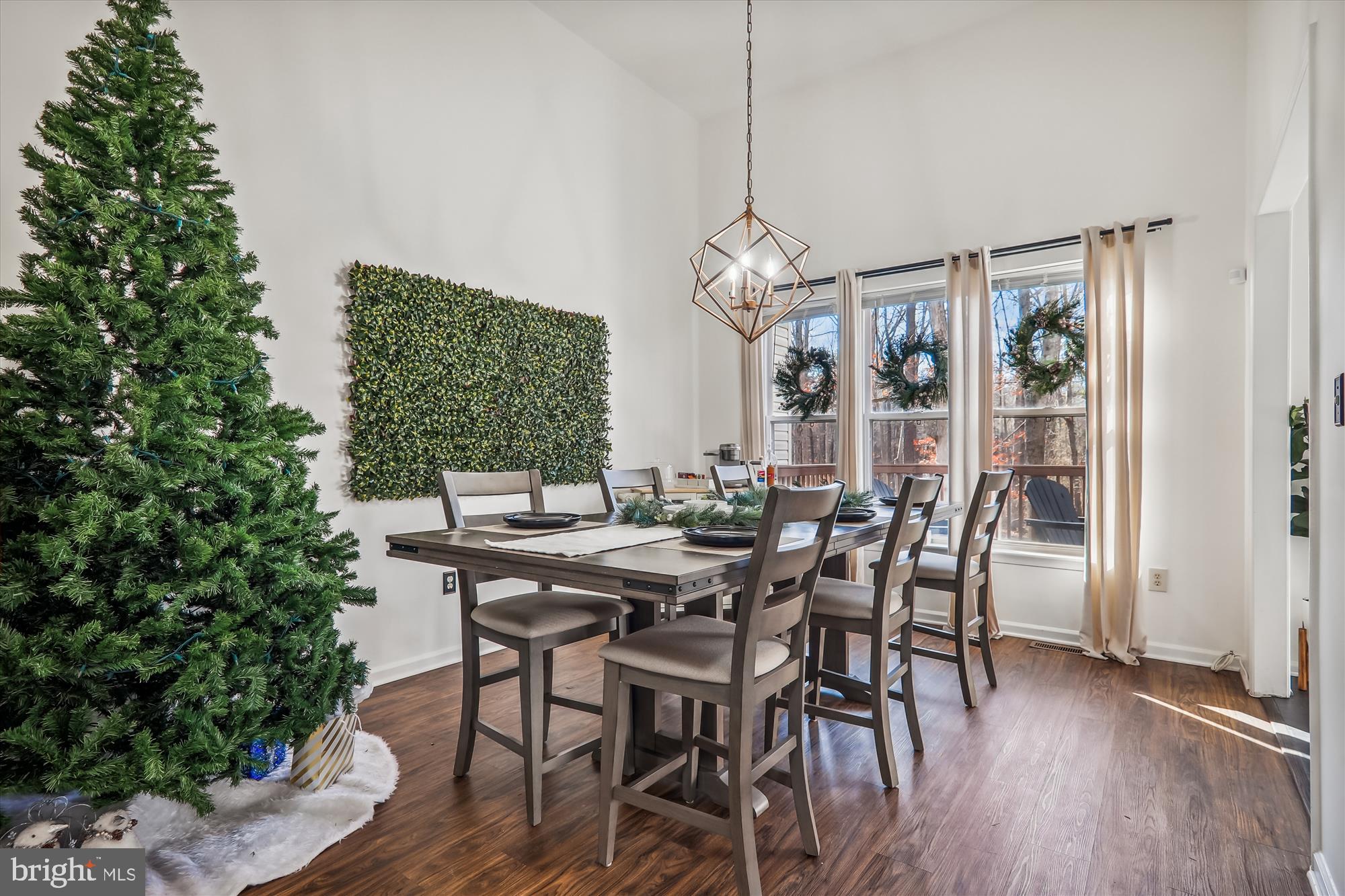 12113 Quilt Patch Lane Bowie, MD 20720 - Photo 9 of 38 a view of a dining room with furniture window and wooden floor