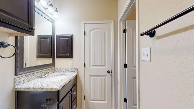 a bathroom with a toilet and a shower curtain