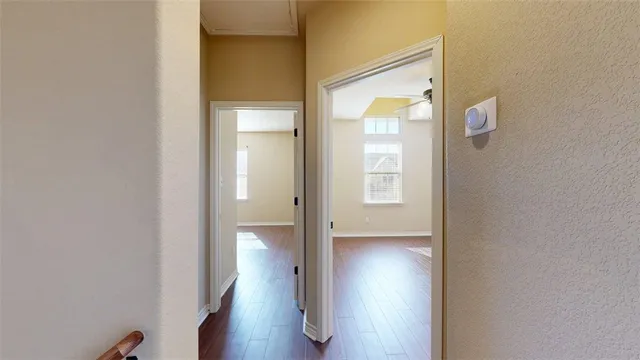 a bathroom with a granite countertop toilet sink and mirror