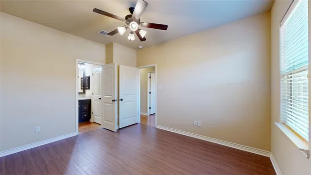 a kitchen with stainless steel appliances granite countertop wooden cabinets a stove top oven a sink and dishwasher