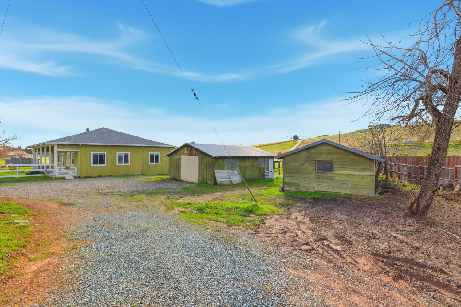 7580 Latrobe Road Shingle Springs, CA 95682 - Photo 3 of 56 a front view of a house with garden