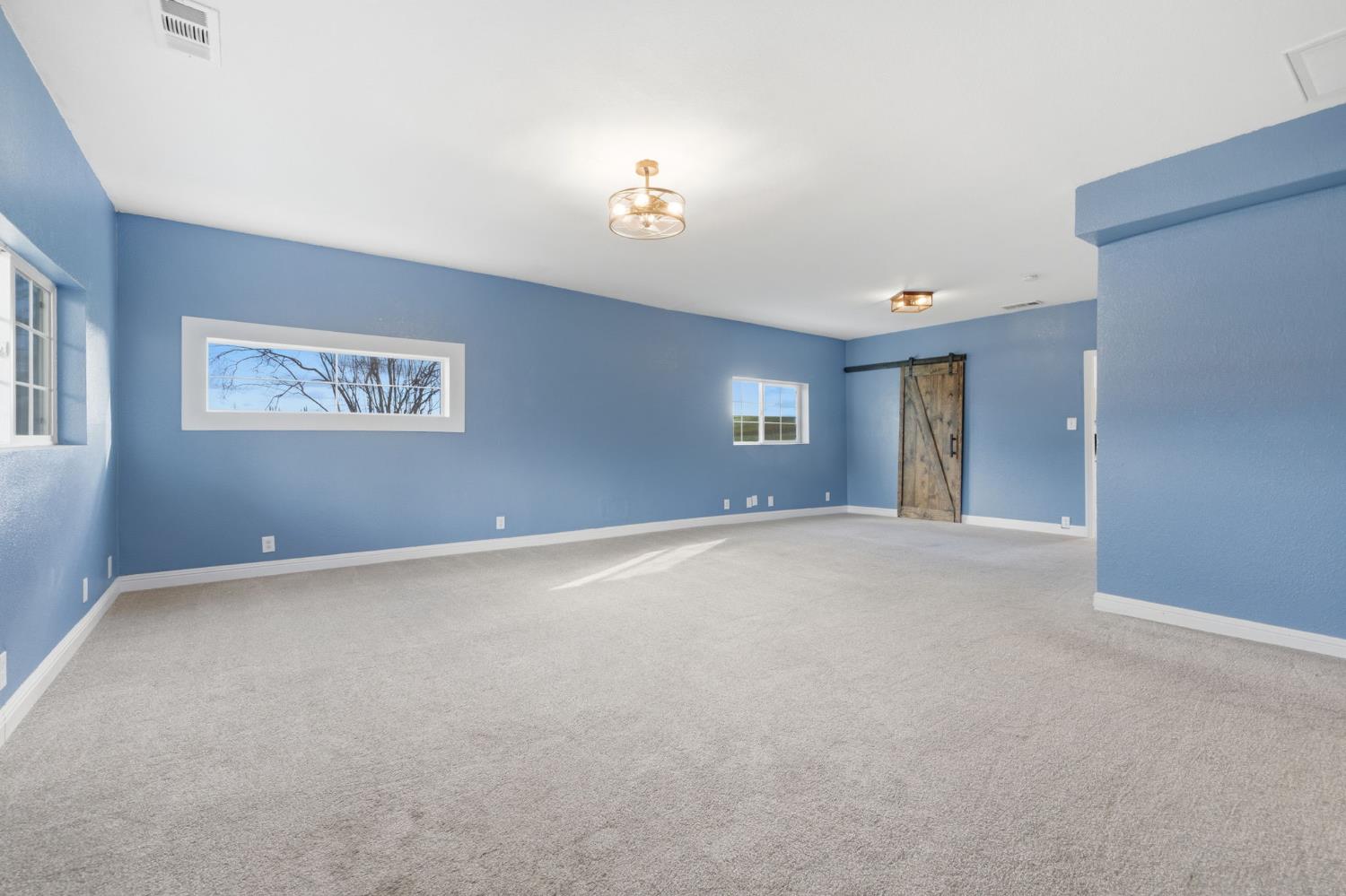 7580 Latrobe Road Shingle Springs, CA 95682 - Photo 5 of 56 a view of an empty room with a window